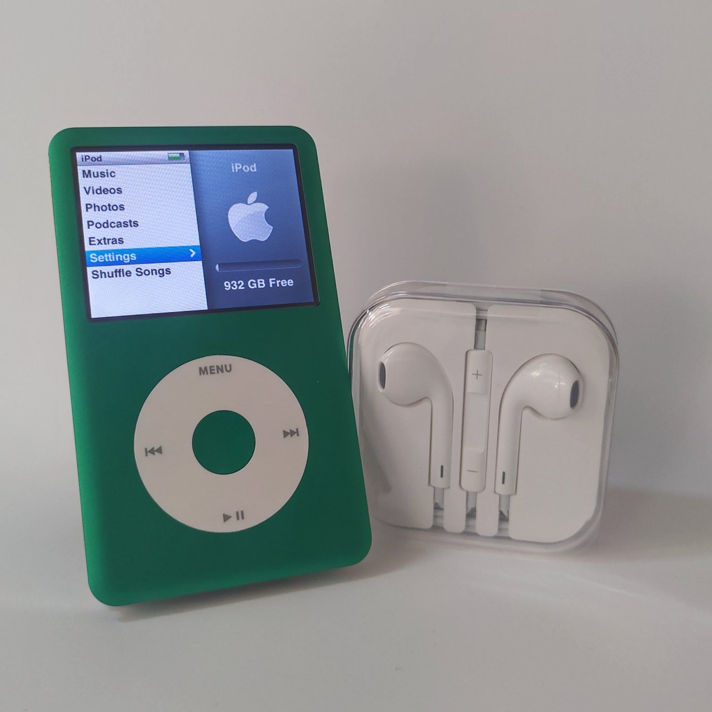 1TB green and white iPod classic with headphones front view