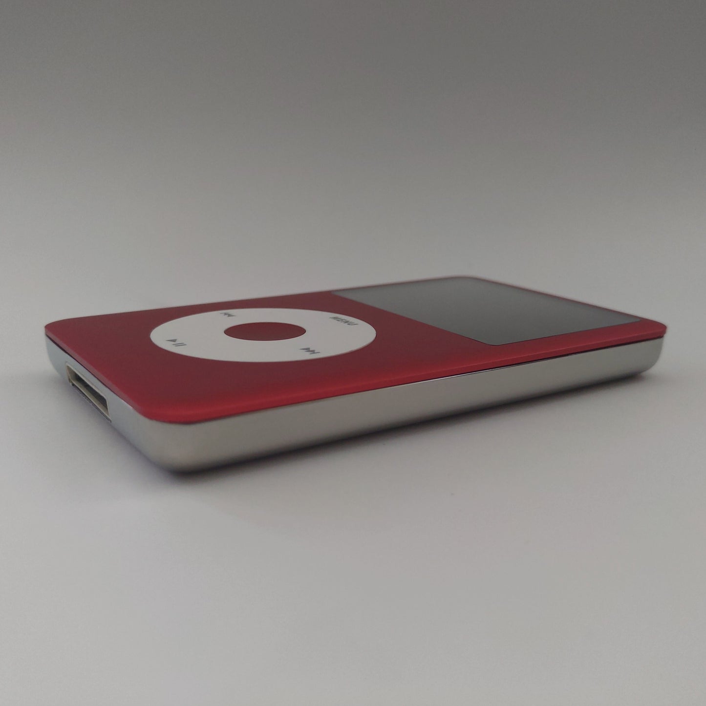 Red iPod classic with White Click Wheel side view