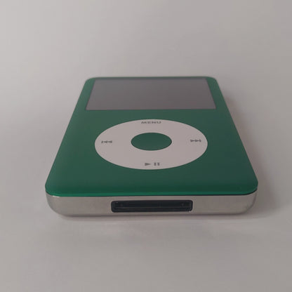 Green iPod Classic with a white click wheel and matching green centre button, viewed from the bottom edge
