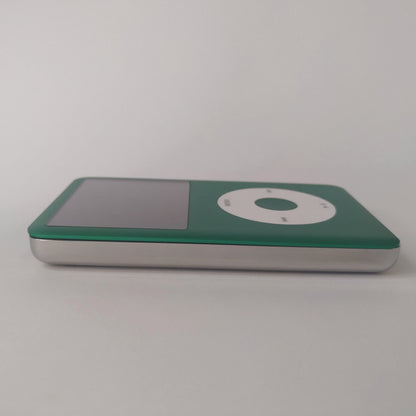 Side view of a green iPod Classic with a white click wheel and polished silver rear housing