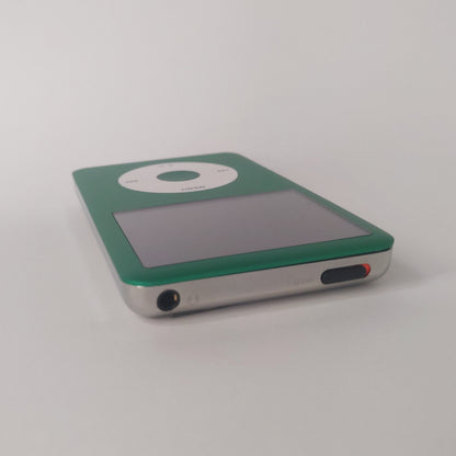 Green iPod Classic with a white click wheel and matching green centre button, viewed from the top edge