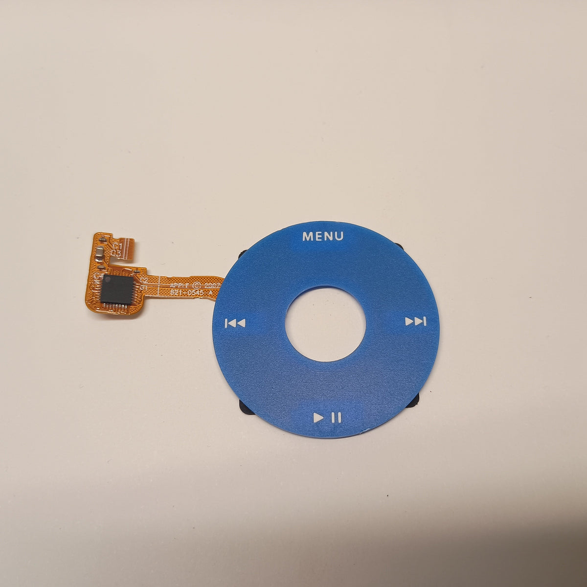 Blue iPod Classic replacement click wheel with white control markings and an attached orange ribbon cable