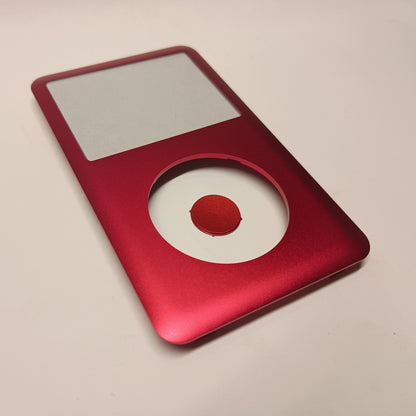Red iPod Classic replacement front housing and matching centre button, shown at an angle from the lower end