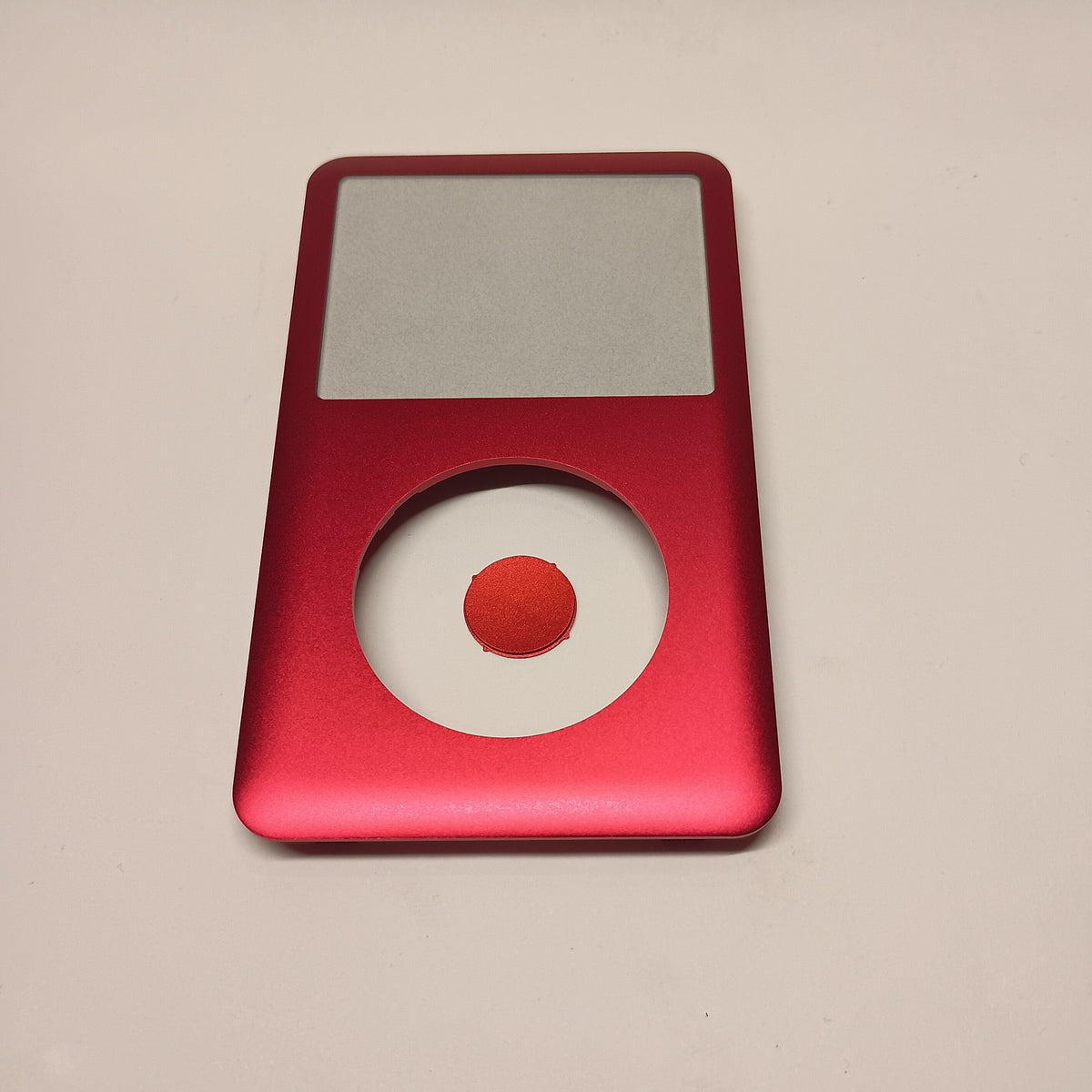 Front view of a red iPod Classic replacement front housing with a matching centre button
