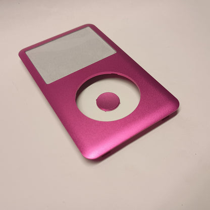 Pink iPod Classic replacement front housing and matching centre button, shown at an angle from the lower end