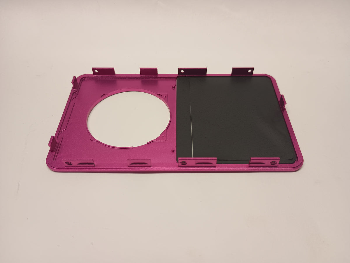 Interior view of a pink iPod Classic replacement front housing with its screen backing and mounting tabs
