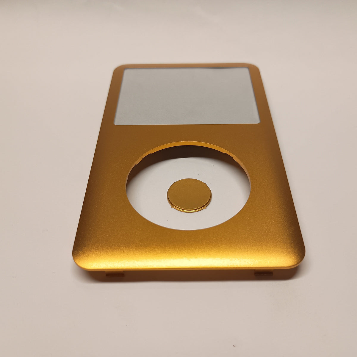 Gold iPod Classic replacement front housing with a matching centre button, viewed from the lower end