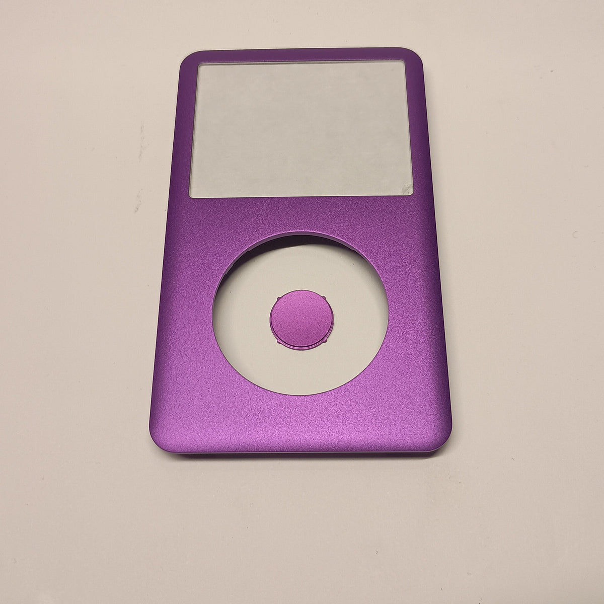 Front view of a purple iPod Classic replacement front housing with a matching centre button