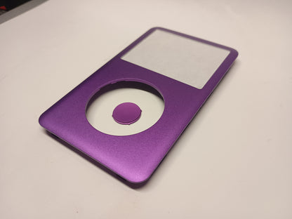 Angled view of a purple iPod Classic replacement front housing with a matching centre button