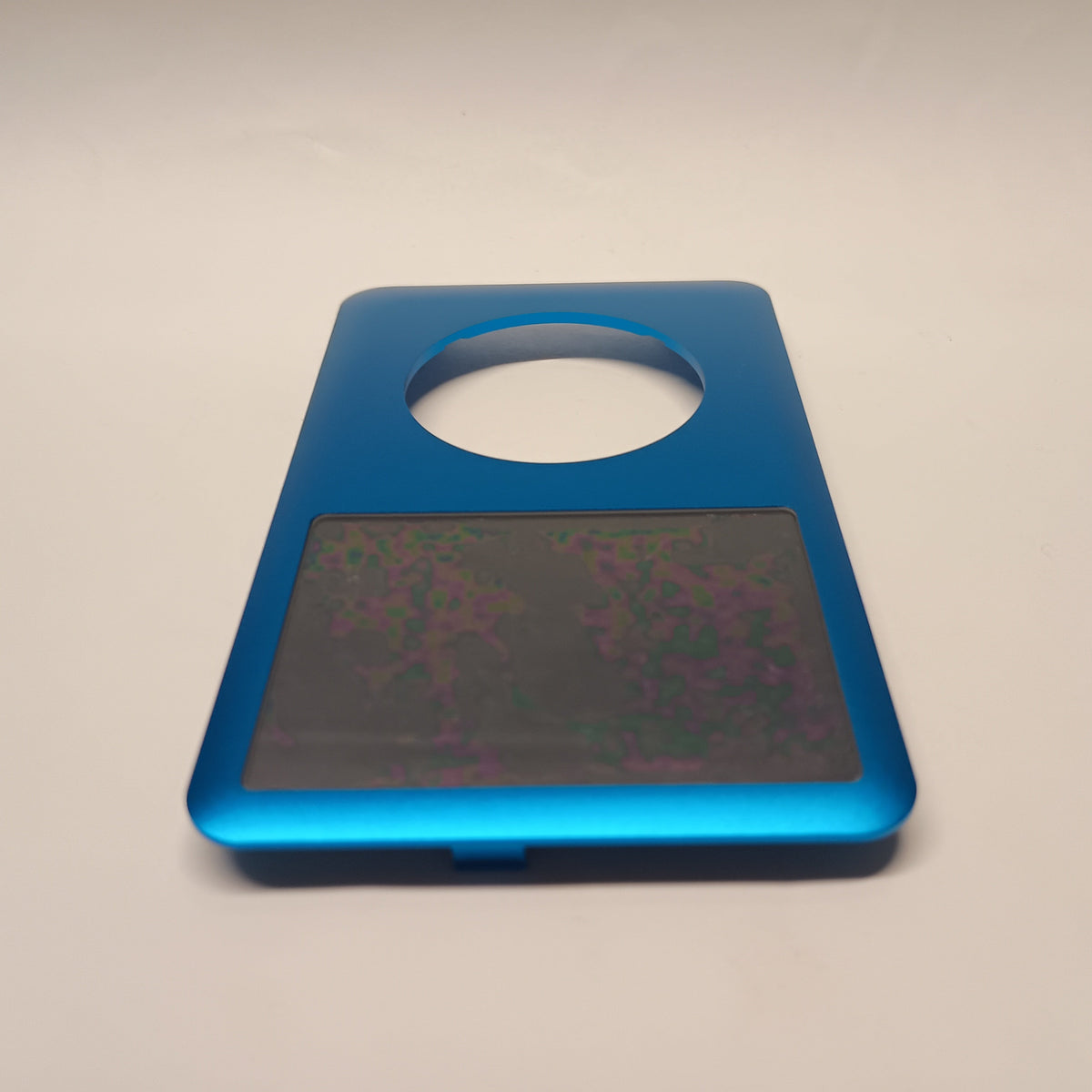 Blue iPod Classic replacement front housing, viewed from the screen end at a low angle