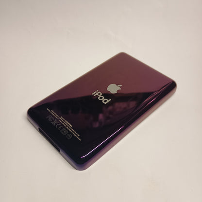 Angled view of a polished purple iPod Classic replacement rear housing with Apple and iPod engraving