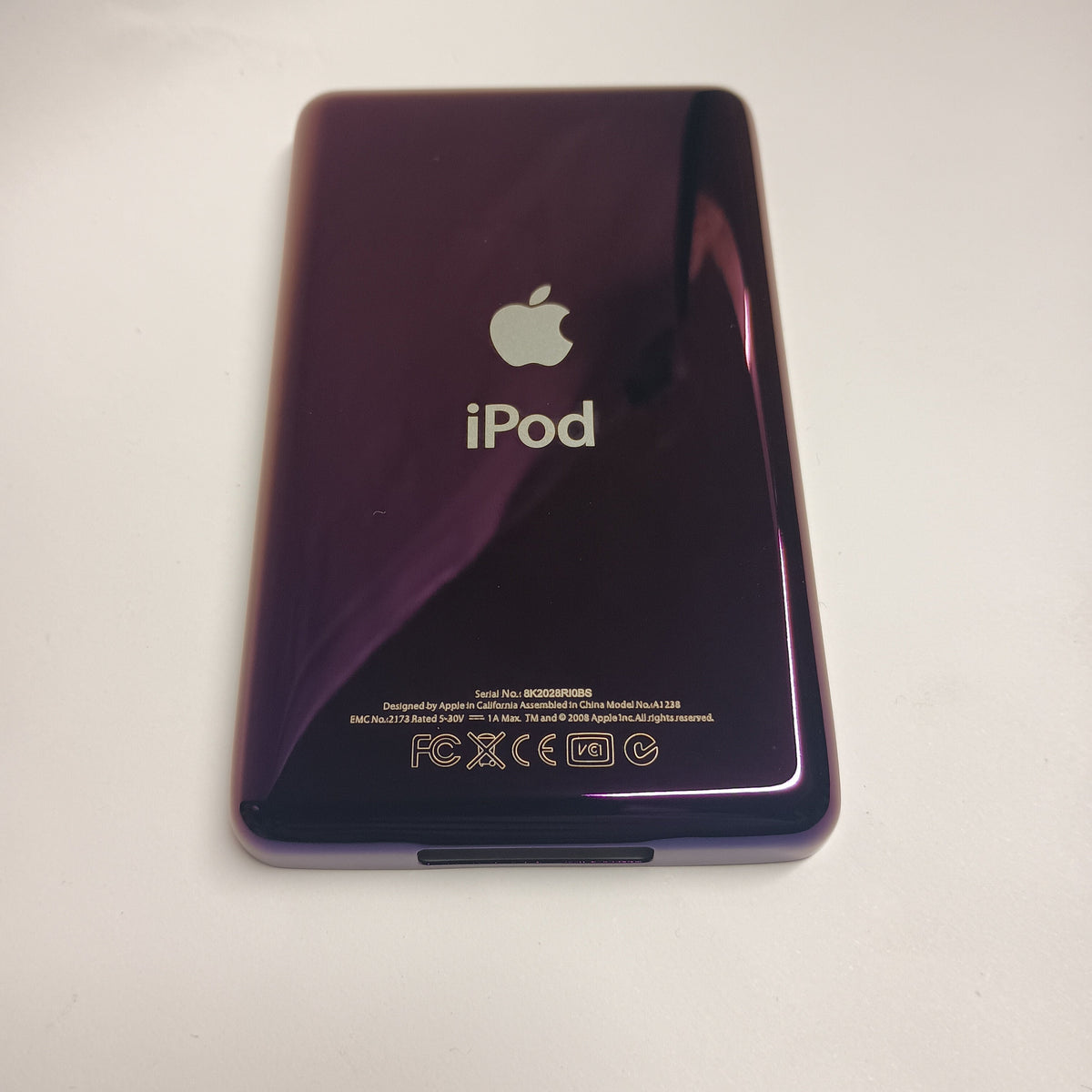 Polished purple iPod Classic replacement rear housing, shown from the back with Apple and iPod engraving