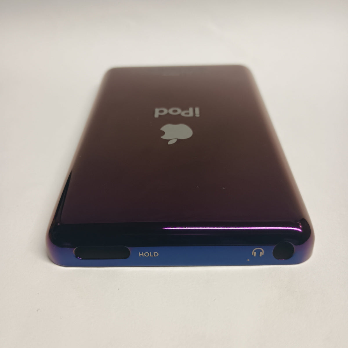 Polished purple iPod Classic replacement rear housing, viewed from the top edge