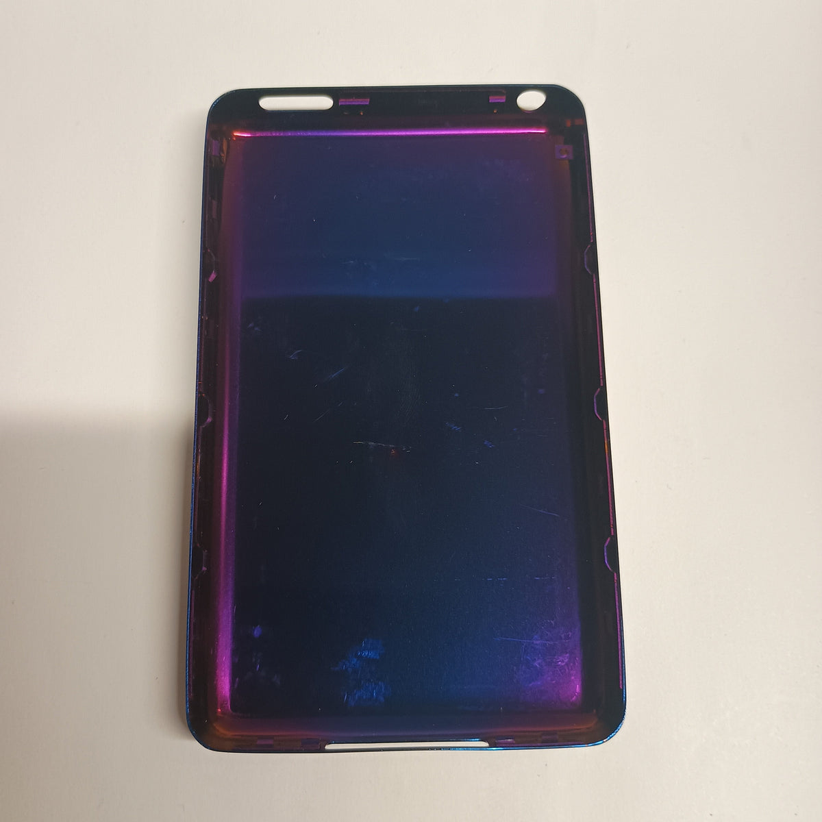 Interior view of a purple iPod Classic replacement rear housing with a reflective metallic finish