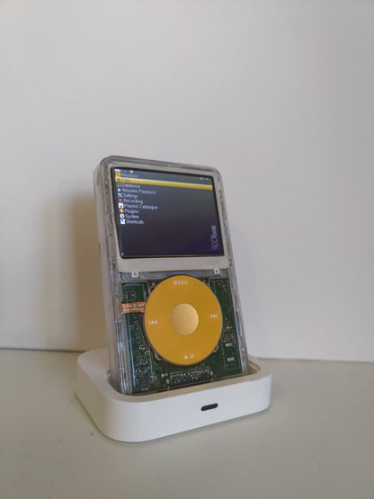 Custom iPod classic running Rockbox with transparent front panel and yellow click wheel with gold centre button