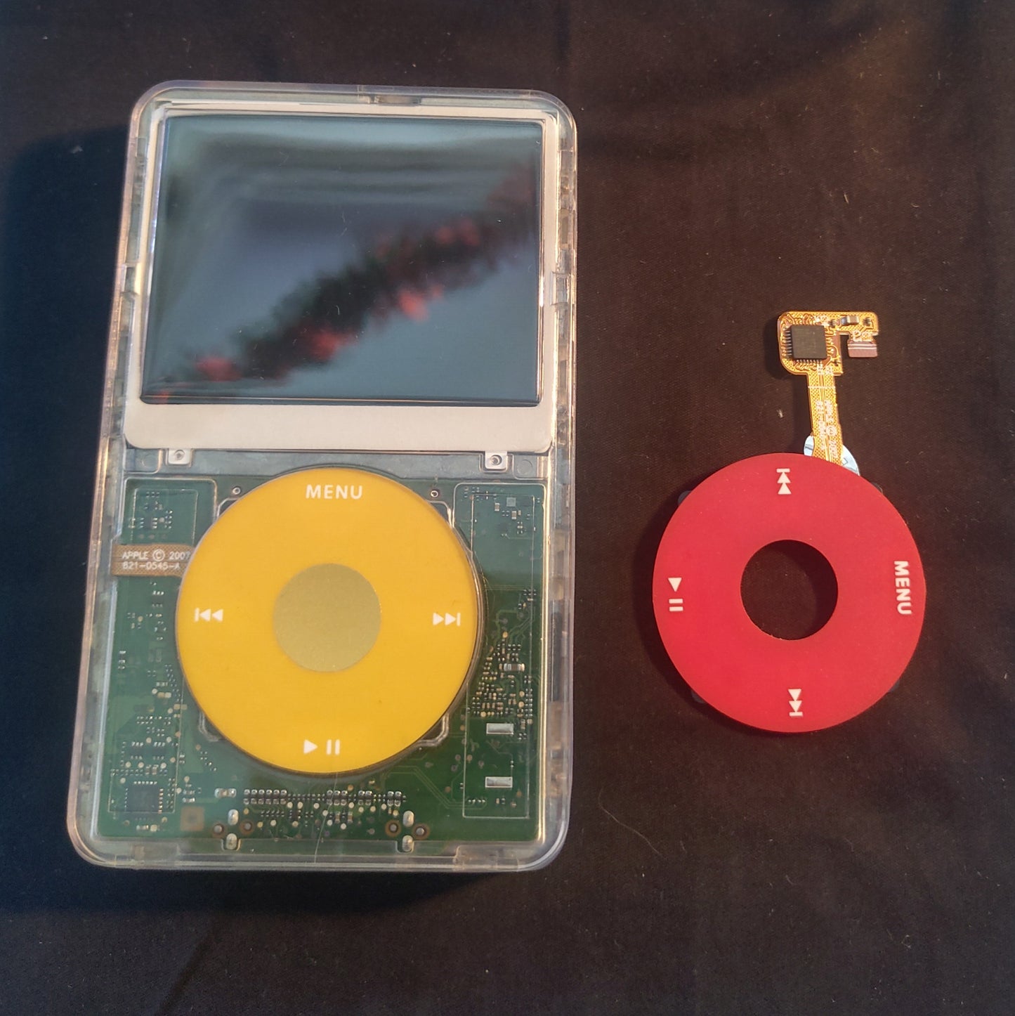 Custom transparent iPod classic with yellow click wheel alosngide red click wheel